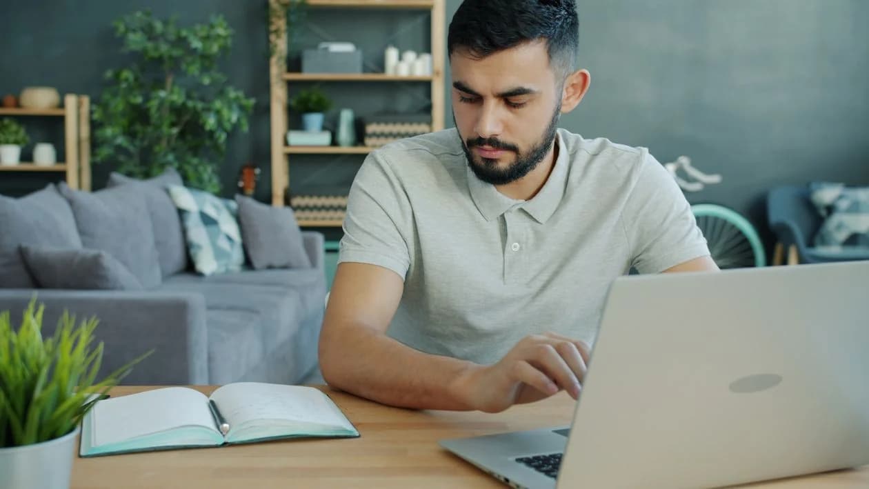 Small-business owner reviewing website options on a laptop